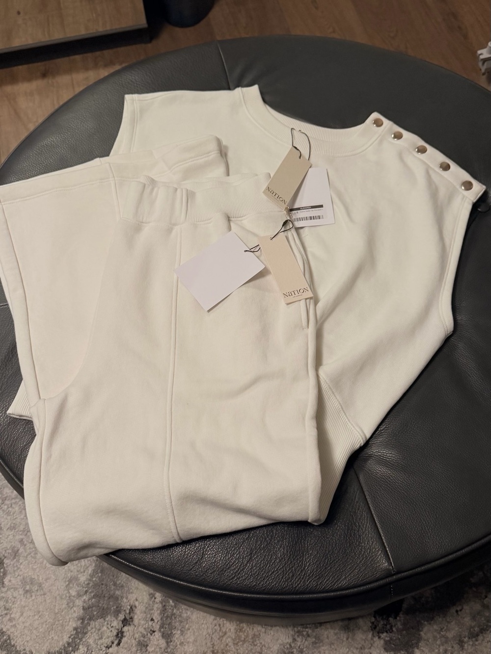 Nation LTD Ivory Sleeveless Track Jumpsuit with Snap-Shoulder Detail
